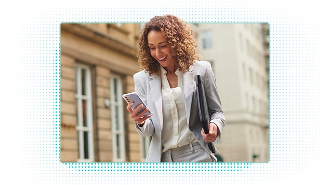 Woman smiling at her mobile phone