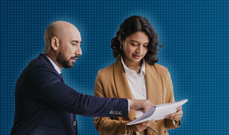 Man and woman discussing paperwork