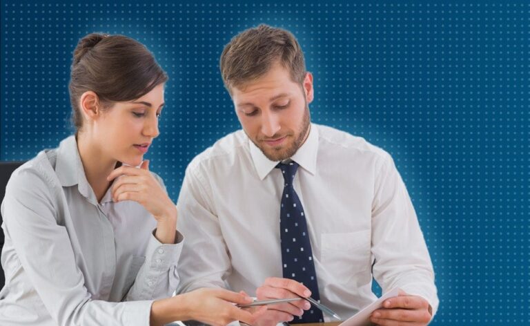 Man and woman discussing paperwork